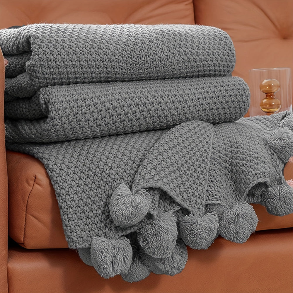 Pomora Throw - Strickdecke mit Pom-Pom-Besatz