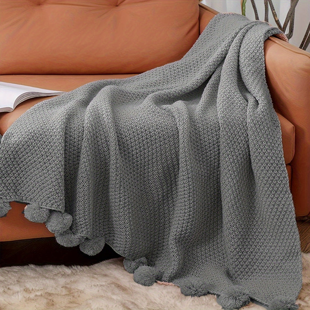 Pomora Throw - Strickdecke mit Pom-Pom-Besatz